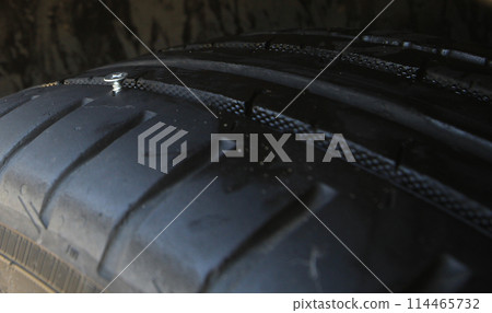 Car Tire Pierced By The Screw Car Tire Pierced By The Screw 114465732