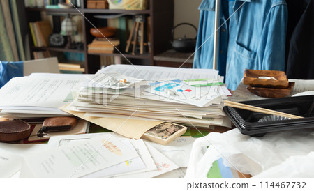 Cash found among piles of documents, secret savings, sorting belongings, messy room Cash found among piles of documents, secret savings, sorting belongings, messy room 114467732