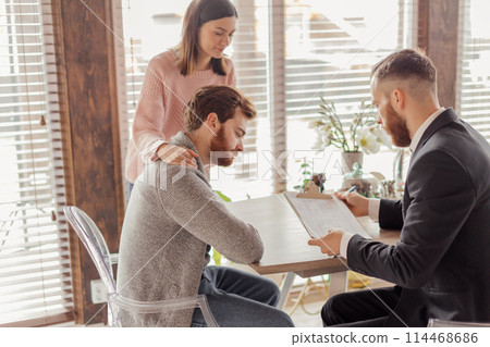 Family couple meeting with agent in office, buying, renting apartment or house. Family couple meeting with agent in office, buying, renting apartment or house. 114468686