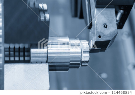 The CNC lathe machine forming cutting the metal shaft parts. The CNC lathe machine forming cutting the metal shaft parts. 114468854