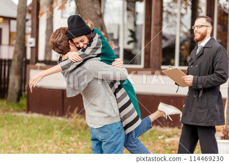 Happy couple embracing after buying new own house, celebrating relocation 114469230