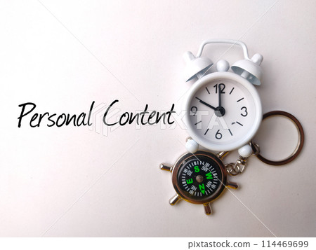 Top view compass and calculator with text Personal Content on white background. 114469699