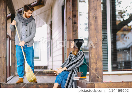 Couple enjoying fall and leisure time outdoors in the private house backyard Couple enjoying fall and leisure time outdoors in the private house backyard 114469992