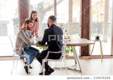 Family couple meeting with agent in office, buying, renting apartment or house. 114470104