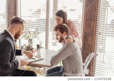 Family couple meeting with agent in office, buying, renting apartment or house. 114470106