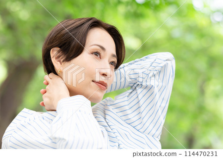 A woman relaxing in the fresh greenery 114470231