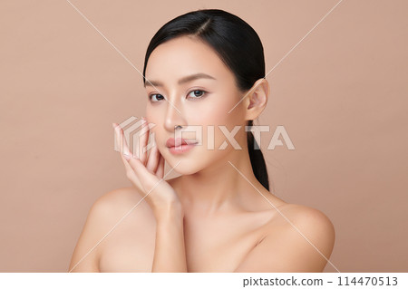 Beautiful young asian woman with clean fresh skin on beige background, Face care, Facial treatment, Cosmetology, beauty and spa, Asian women portrait. 114470513