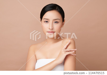 Beautiful young asian woman with clean fresh skin on beige background, Face care, Facial treatment, Cosmetology, beauty and spa, Asian women portrait. 114470515