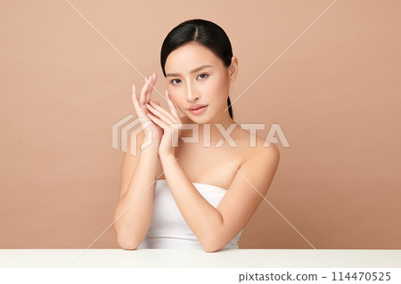 Beautiful young asian woman with clean fresh skin on beige background, Face care, Facial treatment, Cosmetology, beauty and spa, Asian women portrait. 114470525