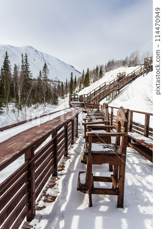 winter cafe, wooden tables and chairs under snow winter cafe, wooden tables and chairs under snow 114470949