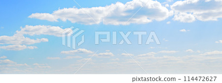 Blue sky and cumulus clouds. Wide photo. 114472627