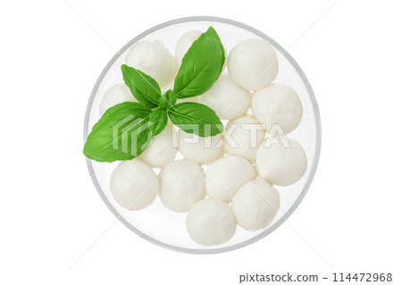 Mini mozzarella balls with basil leaf in a glass bowl isolated on white background. Top view. Flat lay. 114472968