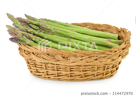 fresh asparagus in in a wicker basket isolated on white background 114472970
