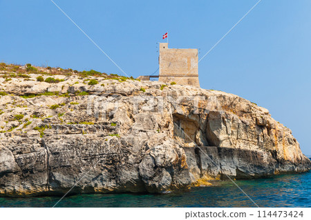 Seaside landscape with Mgarr ix-Xini Tower, Malta 114473424