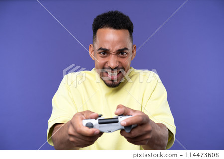 Emotional young black guy in casual raising fists up studio background, celebrating success, happy handsome african american millennial man sharing good emotions, copy space Emotional young black guy in casual raising fists up studio background, celebrating success, happy handsome african american millennial man sharing good emotions, copy space 114473608