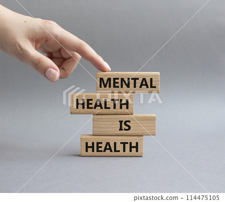 Mental Health symbol. Wooden blocks with words Mental Health is Health. Beautiful grey background. Doctor hand. Medical and Health concept. Copy space. 114475105