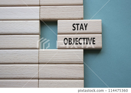 Stay Objective symbol. Wooden blocks with words Stay Objective. Beautiful green background. Business and Stay Objective concept. Copy space. Stay Objective symbol. Wooden blocks with words Stay Objective. Beautiful green background. Business and Stay Objective concept. Copy space. 114475360