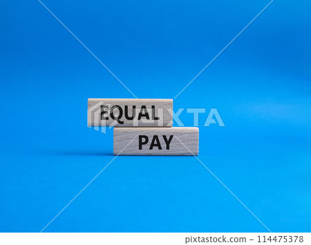 Equal Pay symbol. Wooden blocks with words Equal Pay. Beautiful blue background. Business and Equal Pay concept. Copy space. 114475378
