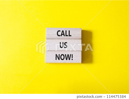 Call us now symbol. Wooden blocks with words Call us now. Beautiful yellow background. Business and Call us now concept. Copy space. Call us now symbol. Wooden blocks with words Call us now. Beautiful yellow background. Business and Call us now concept. Copy space. 114475384