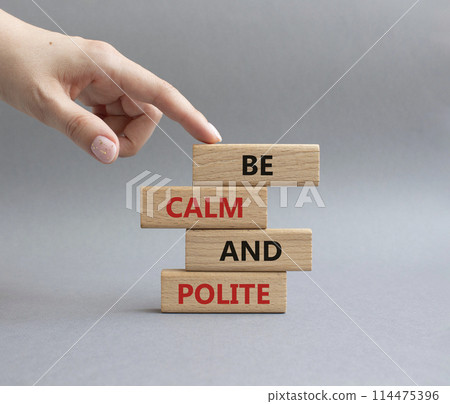 Be Calm and Polite symbol. Concept words Be Calm and Polite on wooden blocks. Businessman hand. Beautiful grey background. Business and Be Calm and Polite concept. Copy space Be Calm and Polite symbol. Concept words Be Calm and Polite on wooden blocks. Businessman hand. Beautiful grey background. Business and Be Calm and Polite concept. Copy space 114475396