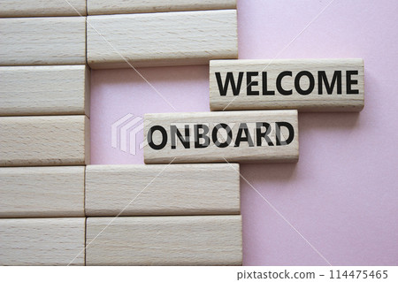 Welcome onboard symbol. Concept words Welcome onboard on wooden blocks. Beautiful pink background. Business and Welcome onboard concept. Copy space. 114475465