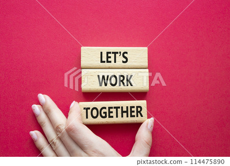 Lets work together symbol. Concept words Less is More on wooden blocks. Businessman hand. Beautiful red background. Business and Less is More concept. Copy space. Lets work together symbol. Concept words Less is More on wooden blocks. Businessman hand. Beautiful red background. Business and Less is More concept. Copy space. 114475890