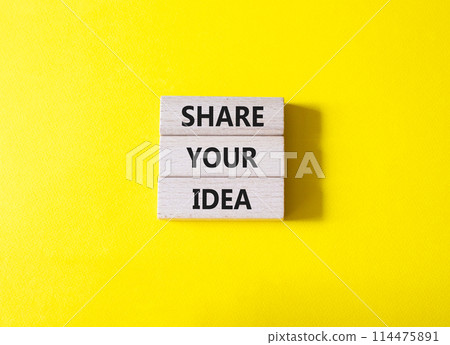 Share your Idea symbol. Concept words Share your Idea on wooden blocks. Beautiful yellow background. Business and Share your Idea concept. Copy space. 114475891