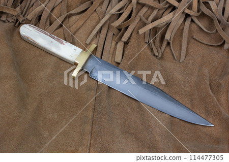 Old west bowie knife on leather jacket Old west bowie knife on leather jacket 114477305
