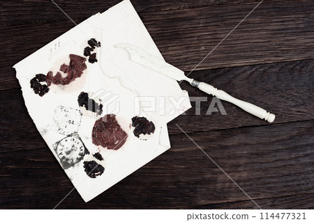 Retro envelope opener knife and vintage letter envelope Retro envelope opener knife and vintage letter envelope 114477321