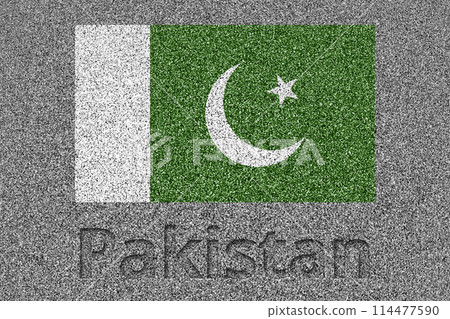 The Pakistani flag painted on a stone slab with the word "Pakistan" carved into it 114477590