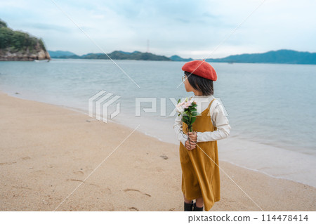 Child girl with the sea in the background Child girl with the sea in the background 114478414