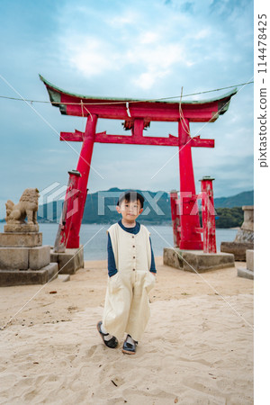 Child boy with the sea in the background Child boy with the sea in the background 114478425