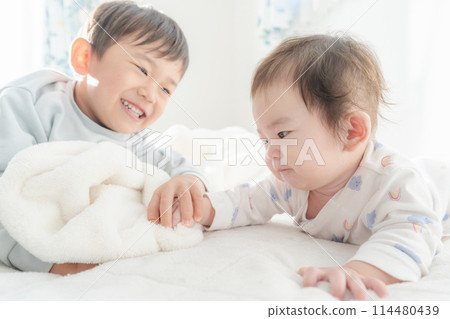 Waking up, nap, baby, brothers, good friends 114480439