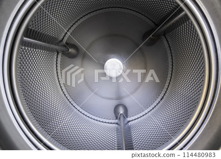 Interior detail of industrial washing machine, hygiene and cleaning Interior detail of industrial washing machine, hygiene and cleaning 114480983