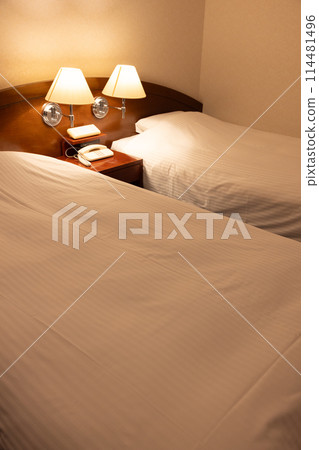 Hotel twin room bed at night 114481496
