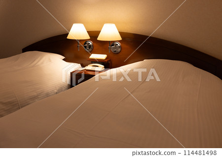 Hotel twin room bed at night 114481498