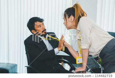 Young female employee seducing boss or supervisor at work Make your boss uncomfortable and afraid of sexual abuse. Concept of sexual harassment in the workplace 114482719