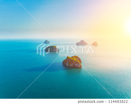 aerial drone view of a beautiful tropical island. Small tropical island in the ocean. Top travel tourist destination, best diving snorkeling. aerial drone view of a beautiful tropical island. Small tropical island in the ocean. Top travel tourist destination, best diving snorkeling. 114483822