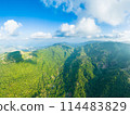 Beautiful view of tropical islands. Mountains and hills of a tropical island covered with jungle  114483829