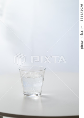 Glass of carbonated water by the window 114483926