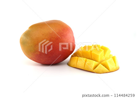 Cubed mango pieces and ripe mango fruit on white Cubed mango pieces and ripe mango fruit on white 114484259