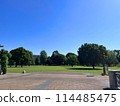 Musashi-Kokubunji Park is filled with greenery and grass on a cloudless, clear day 114485475