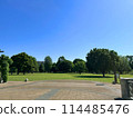 Musashi-Kokubunji Park is filled with greenery and grass on a cloudless, clear day 114485476