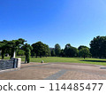 Musashi-Kokubunji Park is filled with greenery and grass on a cloudless, clear day 114485477