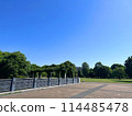 Musashi-Kokubunji Park is filled with greenery and grass on a cloudless, clear day 114485478