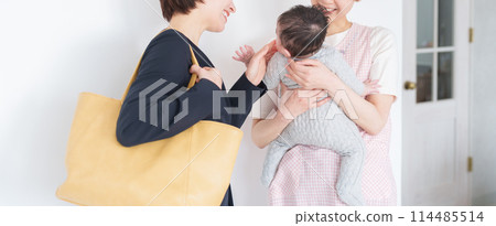A mother leaving her baby at a nursery school A mother leaving her baby at a nursery school 114485514