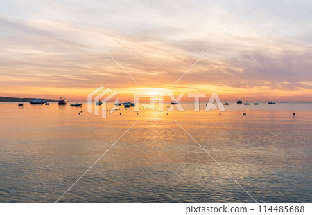 Beautiful red and orange sunrise over the sea. Beautiful red and orange sunrise over the sea. 114485688