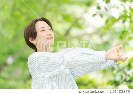 A woman refreshes herself in a new recording A woman refreshes herself in a new recording 114485879