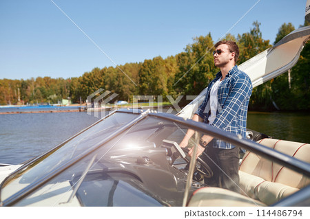 father with adorable daughter and wife resting on big boat 114486794