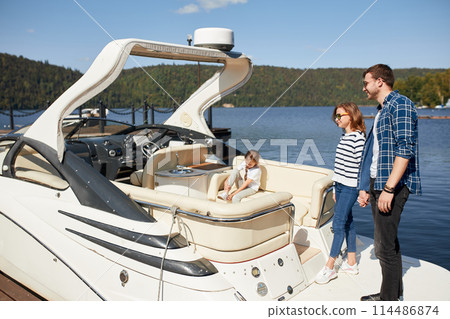 Couple on Yacht. vacation on Boat man and woman. Sailing Sea 114486874
